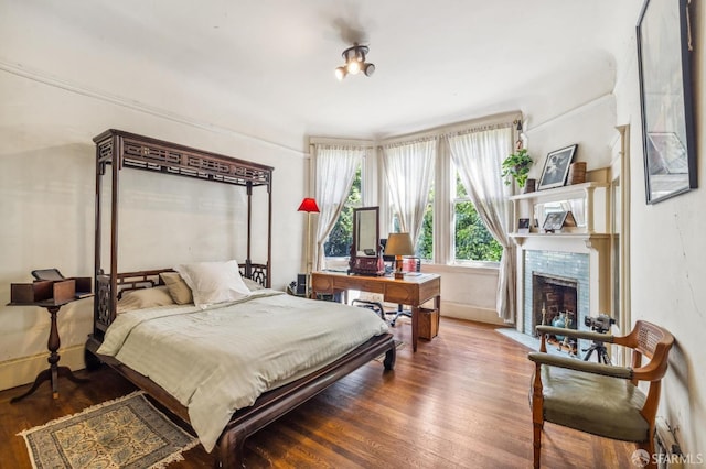 bedroom featuring dark hardwood / wood-style flooring