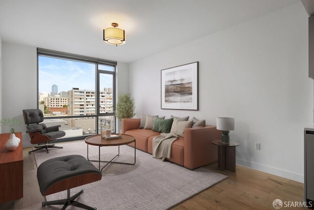1545 Pine St Unit 802, San Francisco, CA 94109 - living area featuring wood finished floors, a city view, and floor to ceiling windows