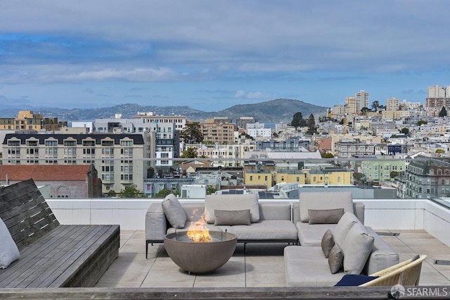 1545 Pine St Unit 802, San Francisco, CA 94109 - view of patio / terrace with a mountain view, an outdoor living space with a fire pit, and a view of city