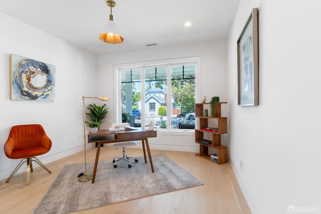 office space with recessed lighting, baseboards, and light wood-style floors