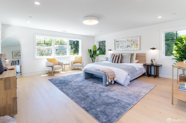 bedroom featuring recessed lighting, light wood-style floors, and baseboards