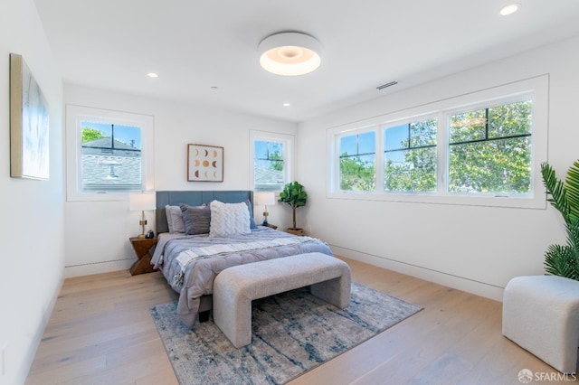 bedroom with recessed lighting, visible vents, and light wood-type flooring