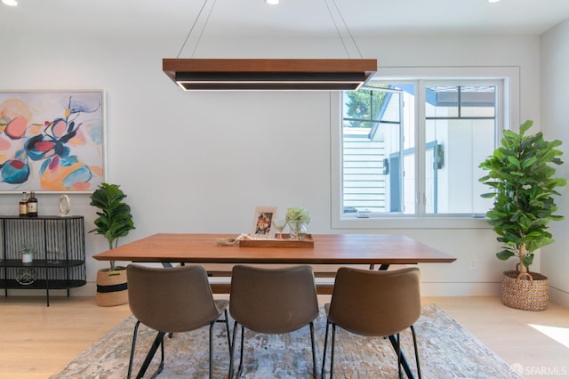 dining area featuring recessed lighting and wood finished floors