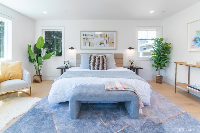 bedroom featuring recessed lighting, wood finished floors, and baseboards