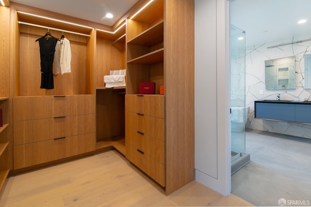 spacious closet with light wood-style flooring