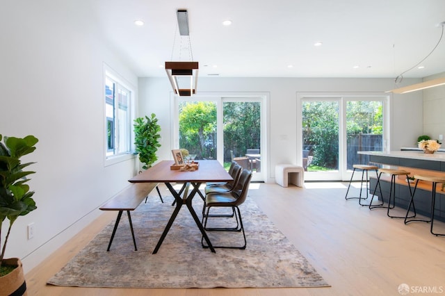 dining area featuring recessed lighting and light wood finished floors