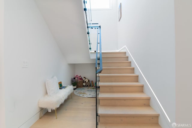 stairs with wood finished floors