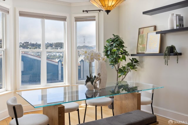 4471 Mission St Unit 2, San Francisco, CA 94112 - dining area with crown molding, baseboards, and wood finished floors