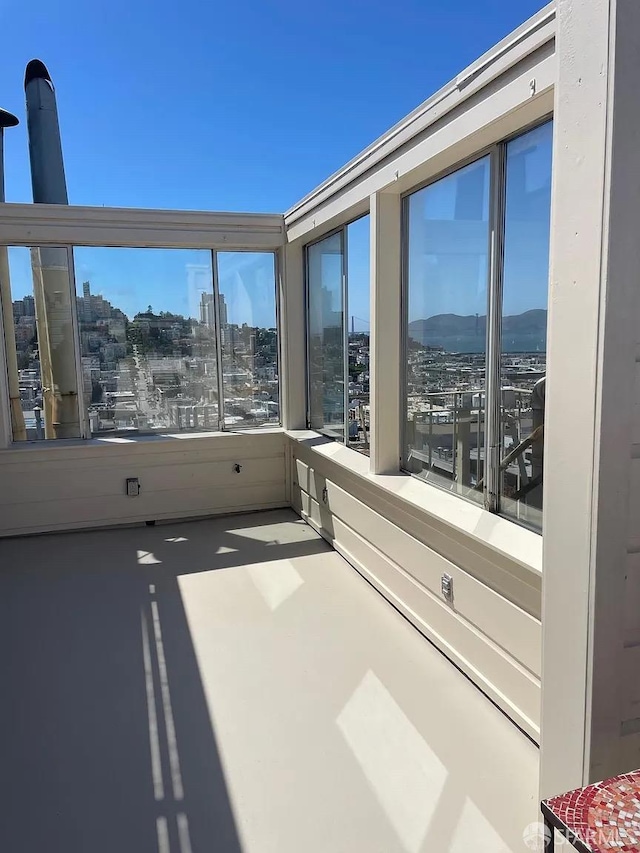 unfurnished room with a view of city