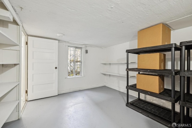 basement featuring a textured ceiling