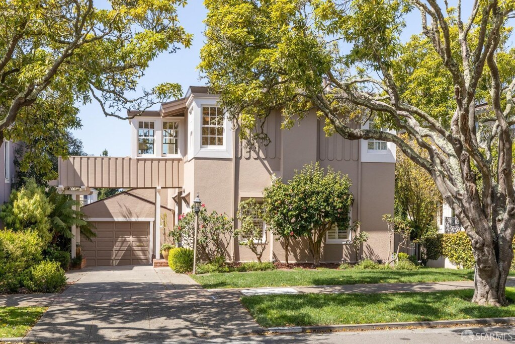 140 San Fernando Way, San Francisco, CA 94127 - view of front of house with driveway, stucco siding, a front yard, and an attached garage