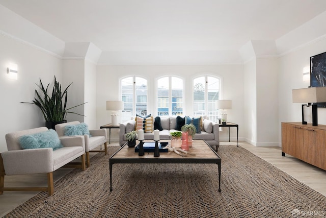 living area with light wood-style flooring and baseboards