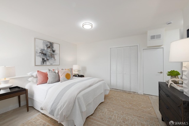 bedroom featuring visible vents and a closet