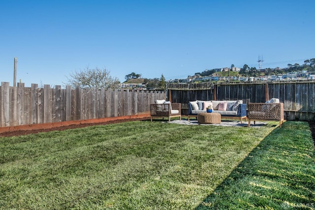 view of yard with a fenced backyard and an outdoor living space