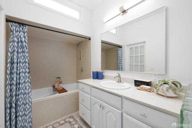 bathroom with shower / tub combo and vanity