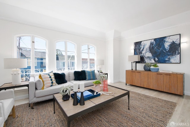 living room featuring light wood-style flooring and baseboards