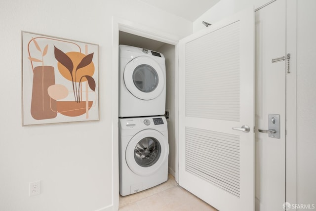 1488 El Camino Real Unit 212, South San Francisco, CA 94080 - washroom featuring stacked washer and clothes dryer and light tile patterned floors