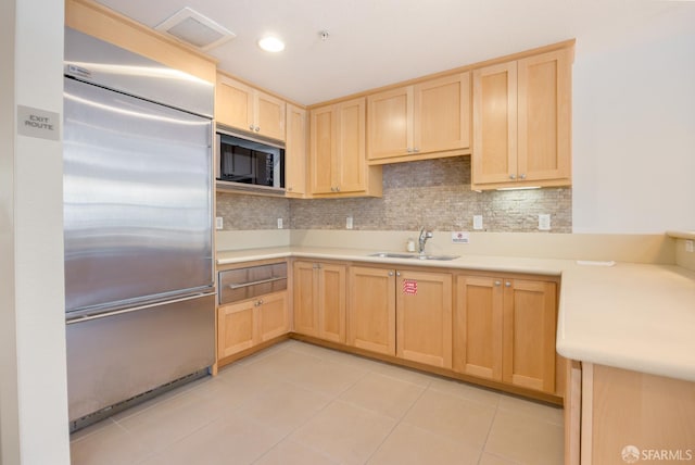 1488 El Camino Real Unit 212, South San Francisco, CA 94080 - kitchen with built in appliances, light brown cabinetry, and light countertops