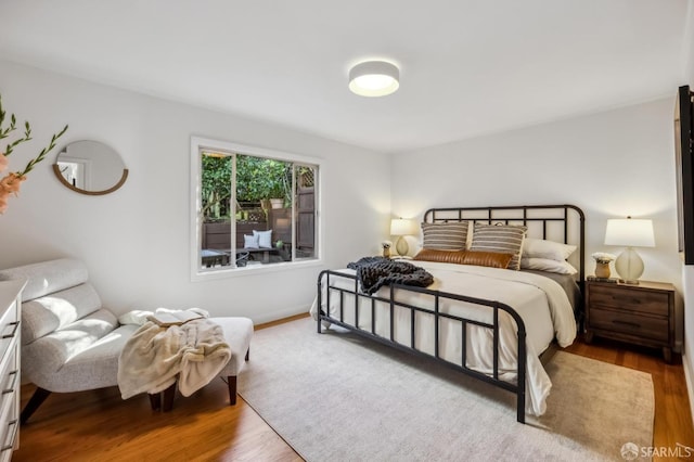 bedroom with hardwood / wood-style floors