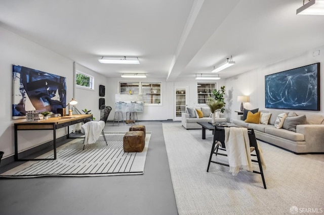 living room featuring concrete floors