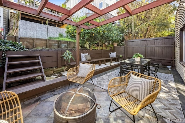 view of patio featuring an outdoor fire pit and a pergola