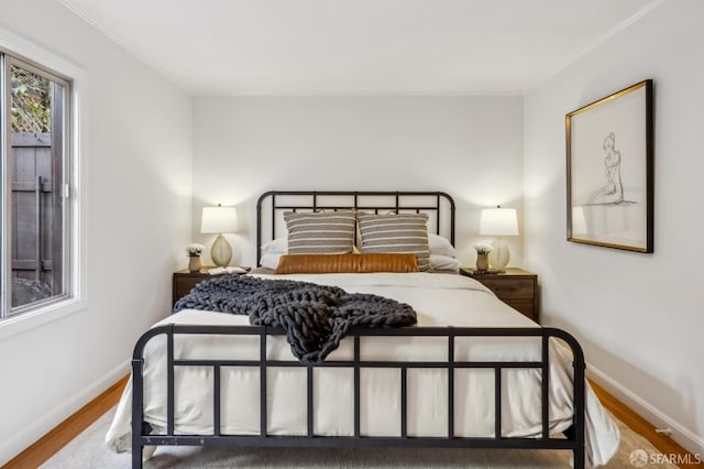 bedroom with hardwood / wood-style flooring