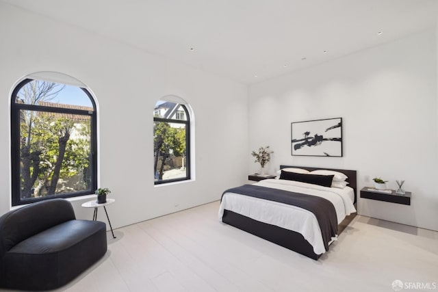 bedroom with light hardwood / wood-style floors