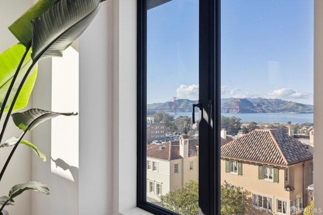 room details featuring a water and mountain view