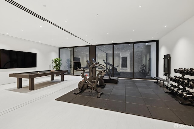 interior space with pool table and floor to ceiling windows