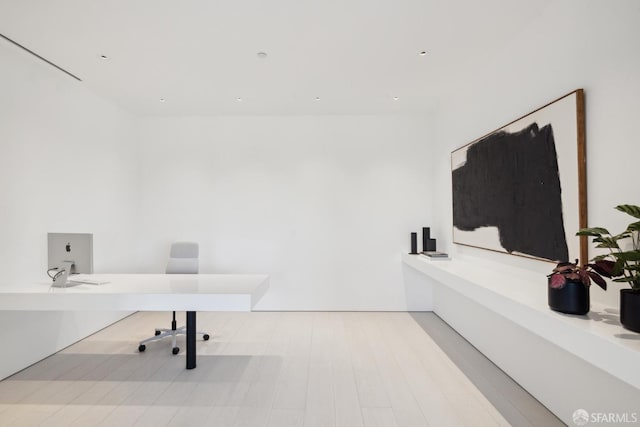 office area with light hardwood / wood-style flooring