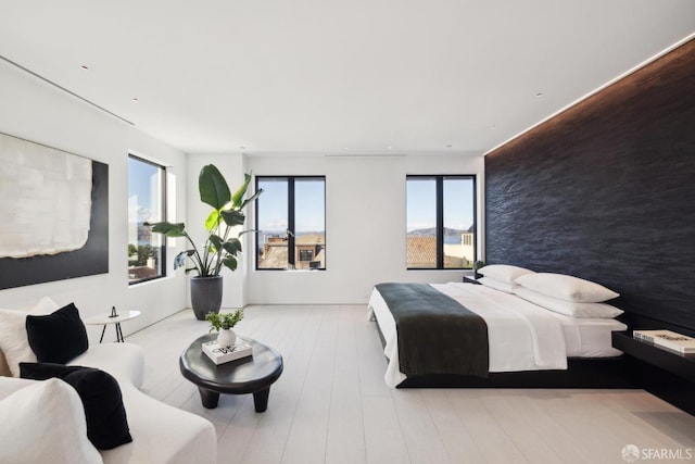 bedroom with light wood-type flooring