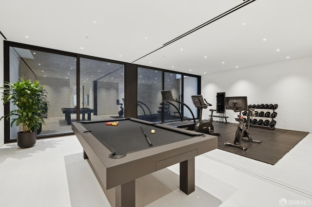 game room with floor to ceiling windows and pool table