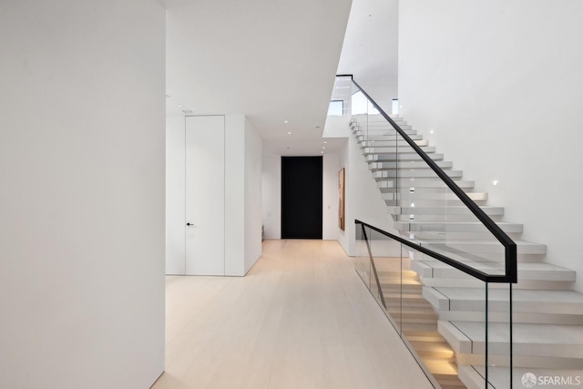 staircase featuring hardwood / wood-style floors