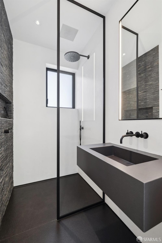 bathroom with sink and a shower