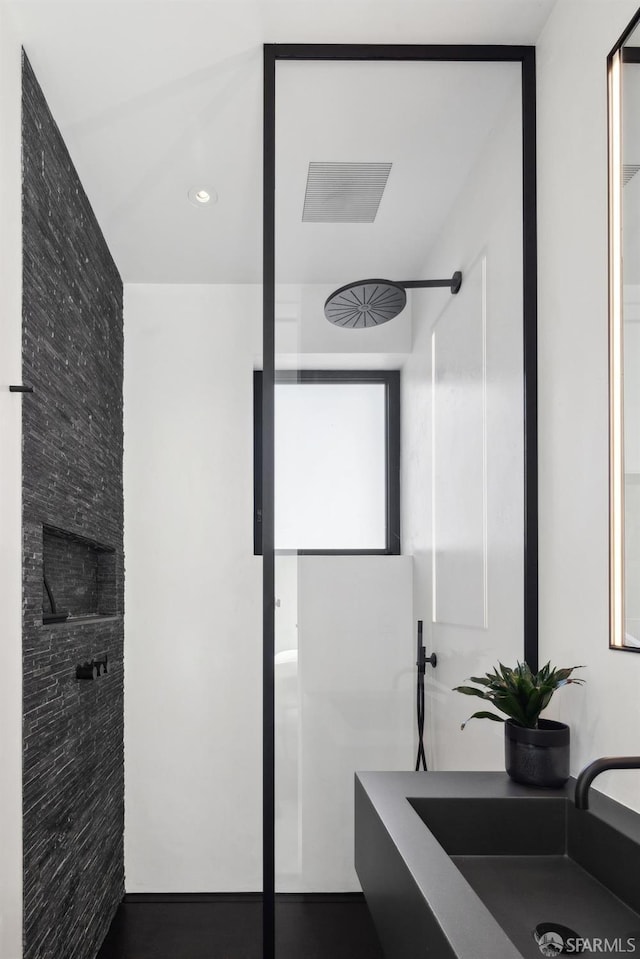 bathroom with sink and a shower