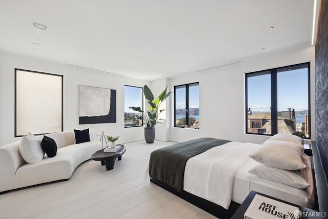 bedroom with light hardwood / wood-style flooring