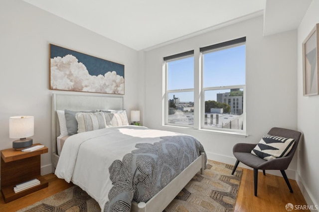 566 S Van Ness Ave Unit 31, San Francisco, CA 94110 - bedroom featuring baseboards and wood finished floors