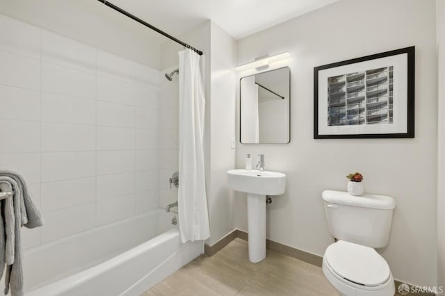 566 S Van Ness Ave Unit 31, San Francisco, CA 94110 - bathroom featuring shower / tub combo with curtain and wood finished floors