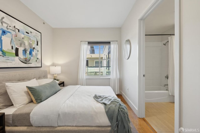 566 S Van Ness Ave Unit 31, San Francisco, CA 94110 - bedroom with wood finished floors and connected bathroom