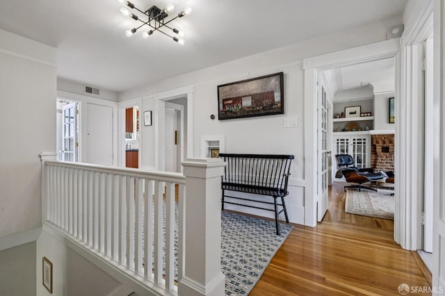207 Eureka St, San Francisco, CA 94114 - hall featuring wood finished floors and a chandelier