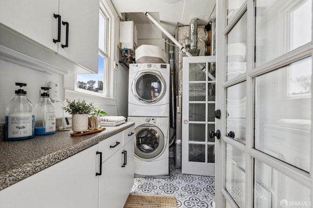 207 Eureka St, San Francisco, CA 94114 - laundry room featuring stacked washer / drying machine, plenty of natural light, and light tile patterned floors