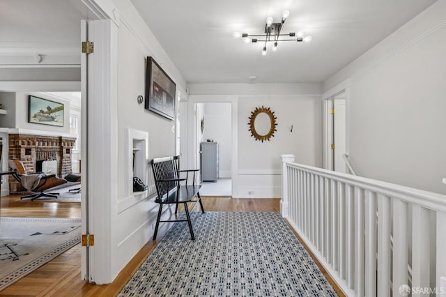 207 Eureka St, San Francisco, CA 94114 - hall with a chandelier, an upstairs landing, and wood finished floors