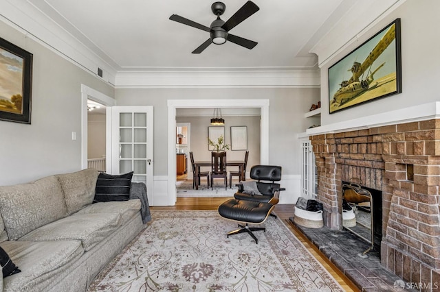 207 Eureka St, San Francisco, CA 94114 - living area with wood finished floors, ceiling fan, ornamental molding, and a fireplace