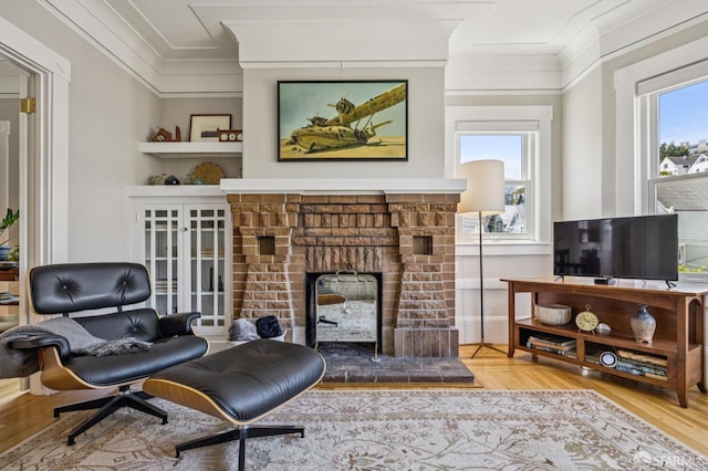 207 Eureka St, San Francisco, CA 94114 - sitting room with ornamental molding, wood finished floors, and a fireplace