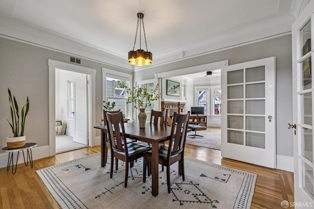 207 Eureka St, San Francisco, CA 94114 - dining space featuring healthy amount of natural light, a ceiling fan, light wood-type flooring, and french doors