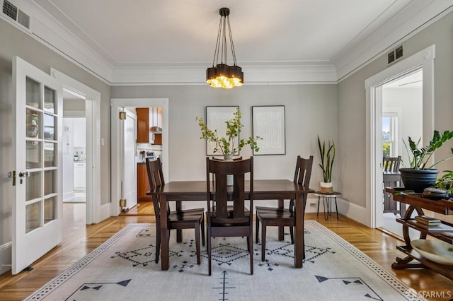 207 Eureka St, San Francisco, CA 94114 - dining space featuring a chandelier, crown molding, baseboards, and french doors