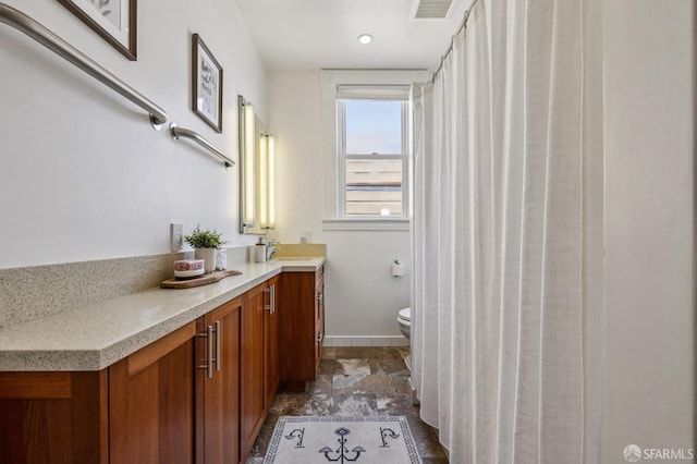 207 Eureka St, San Francisco, CA 94114 - bathroom featuring vanity, toilet, and baseboards