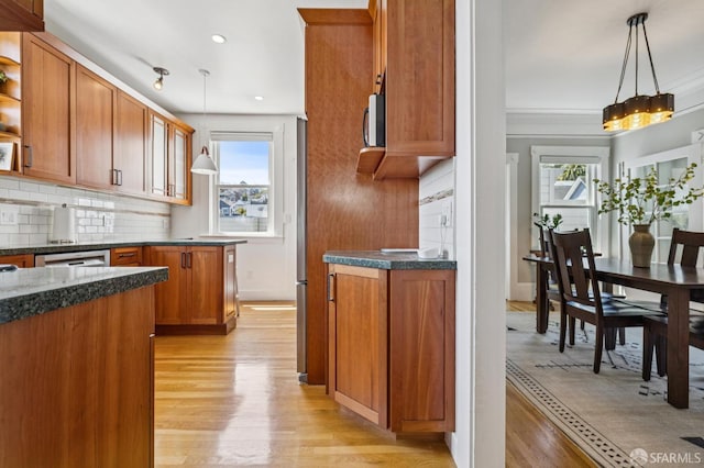 207 Eureka St, San Francisco, CA 94114 - kitchen featuring light wood-style flooring, brown cabinets, open shelves, tasteful backsplash, and hanging light fixtures