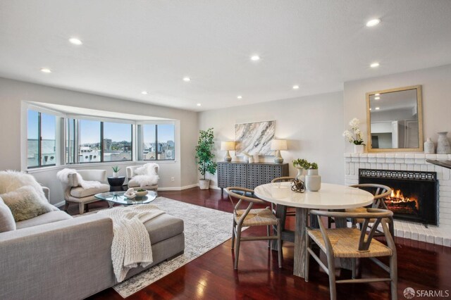 360 Guerrero St Unit 408, San Francisco, CA 94103 - living area featuring a fireplace, wood finished floors, baseboards, and recessed lighting
