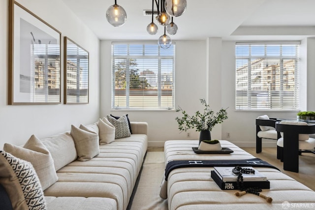 living room featuring visible vents and baseboards